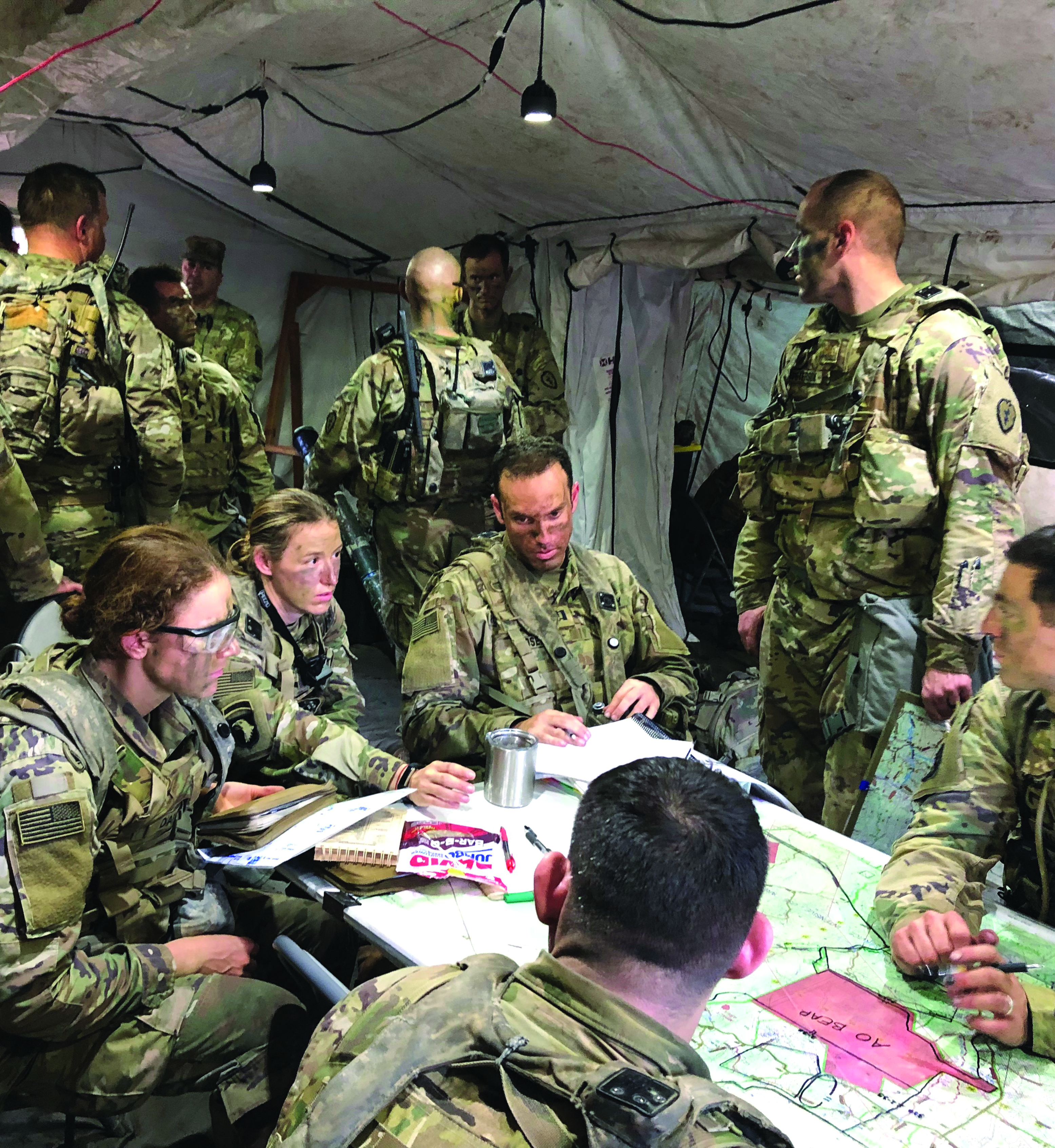 A JA discusses strategy with the brigade staff at
        JRTC. (Photo credit: LTC Ryan Howard)